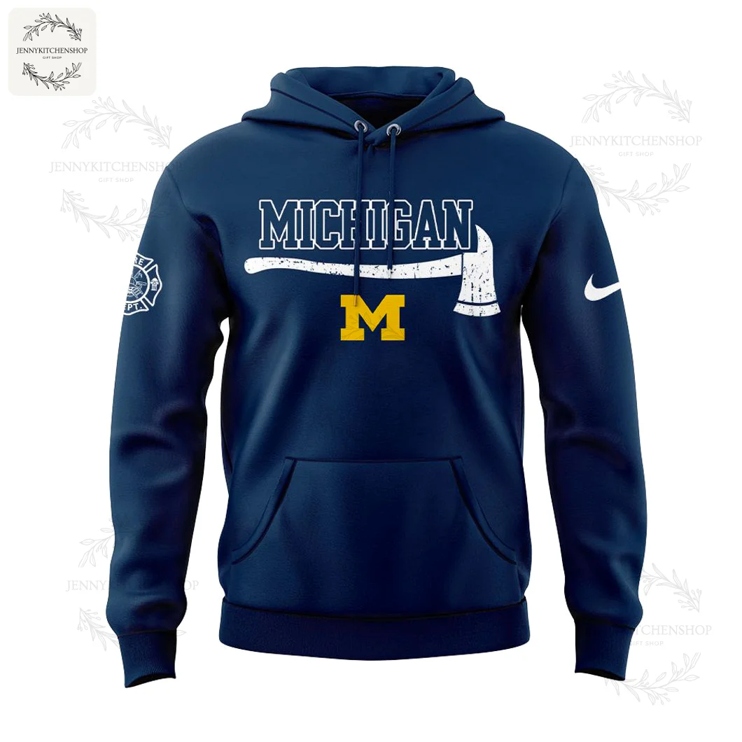 Back view of navy hoodie with large circular firefighter emblem surrounding a yellow M, reading "Firefighter" and "Michigan Wolverines," with sleeve badge visible
