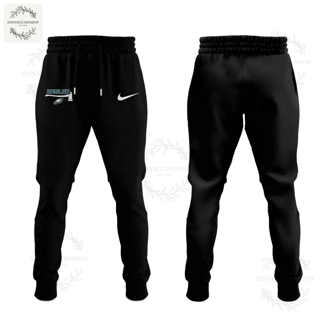 Front and back views of black jogger pants with elastic waistband and drawstring, showing a small Eagles axe graphic and Nike swoosh on the front left hip and tapered cuffs.