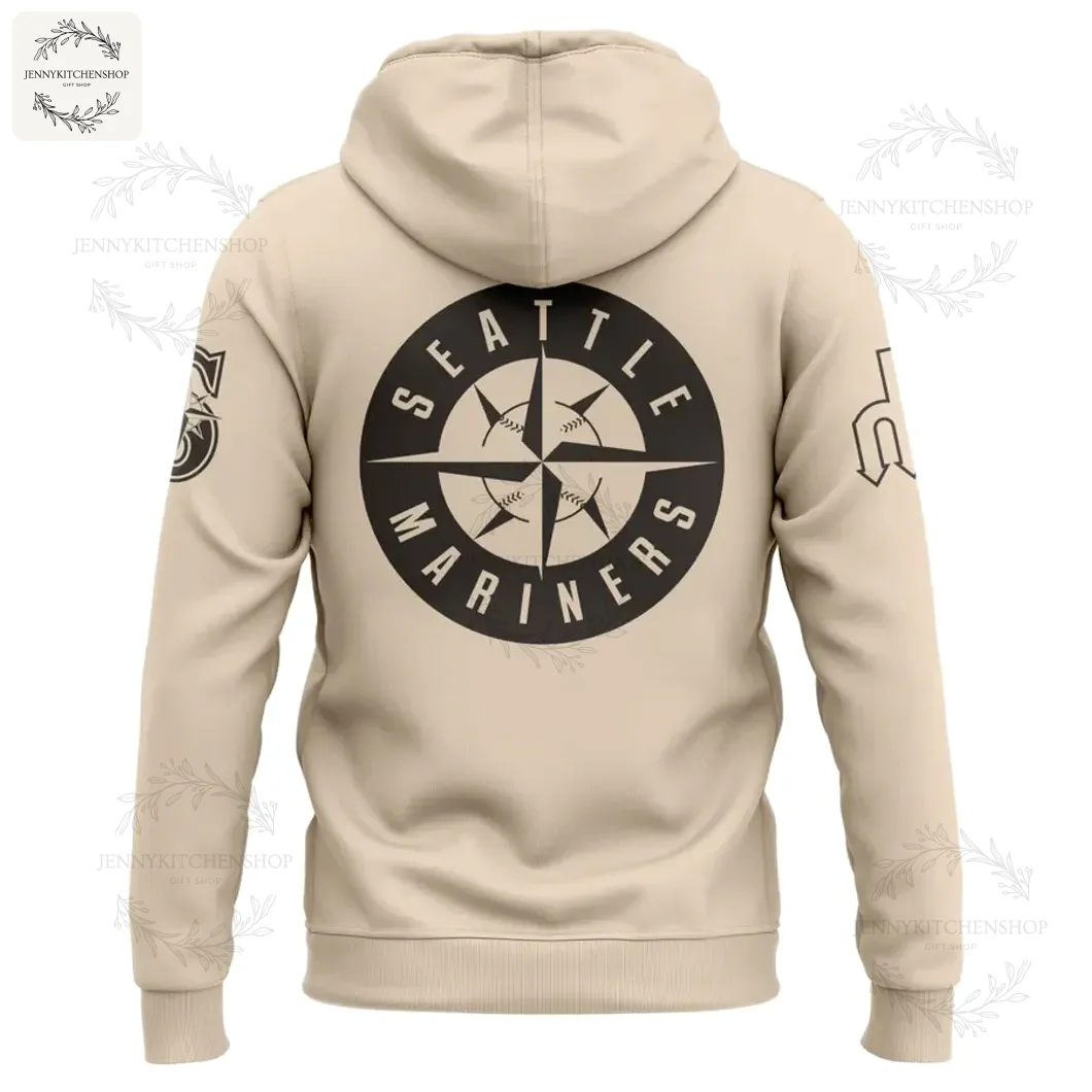 The back of the beige Seattle Mariners hoodie showing the large black circular compass logo with a baseball in the center.