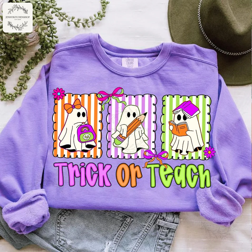A purple sweatshirt styled with jeans, showing the "Trick Or Teach" design with three adorable ghosts for a teacher's Halloween outfit.