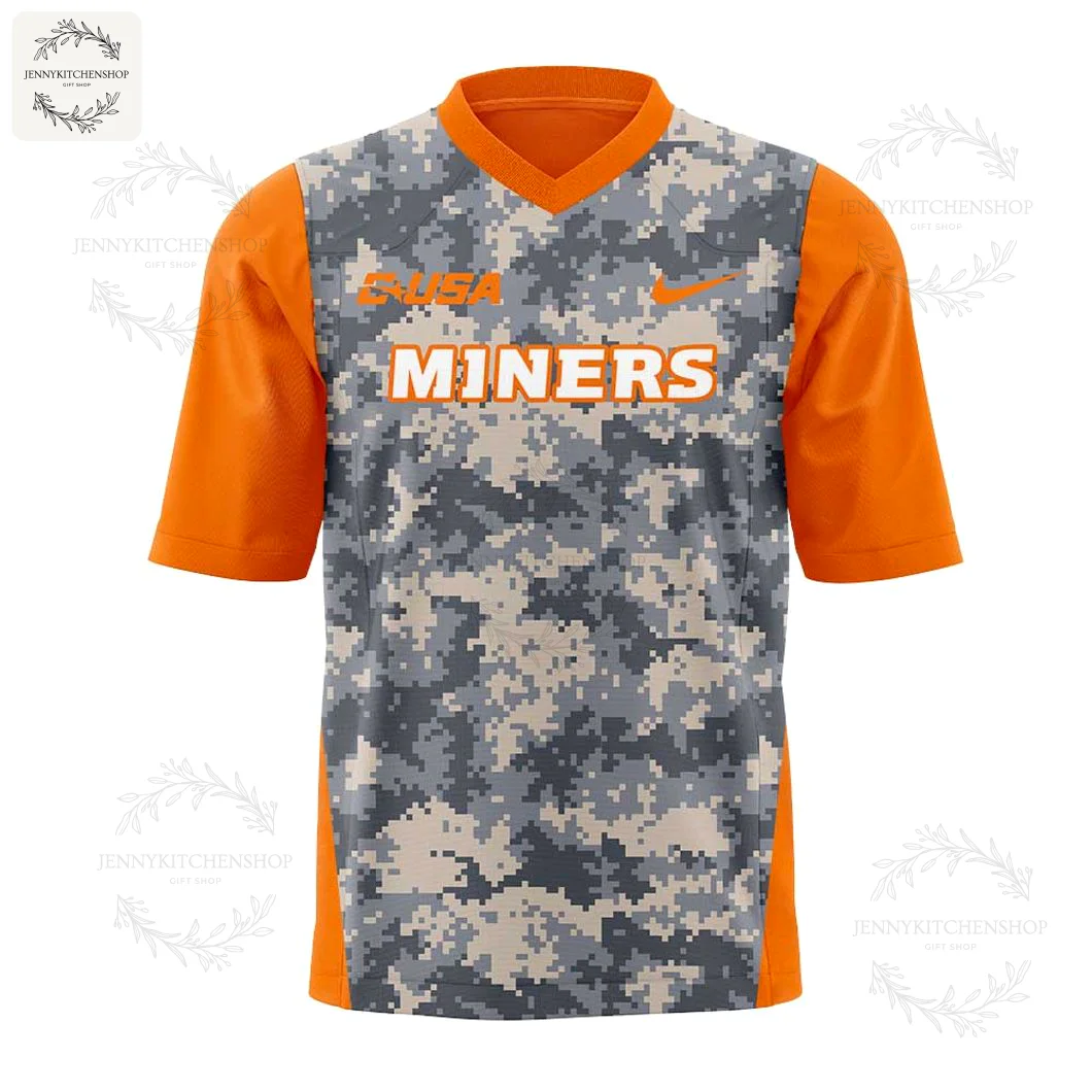 Front of the UTEP Miners For Our Heroes football jersey, featuring a digital camo pattern, orange sleeves, and MINERS text.