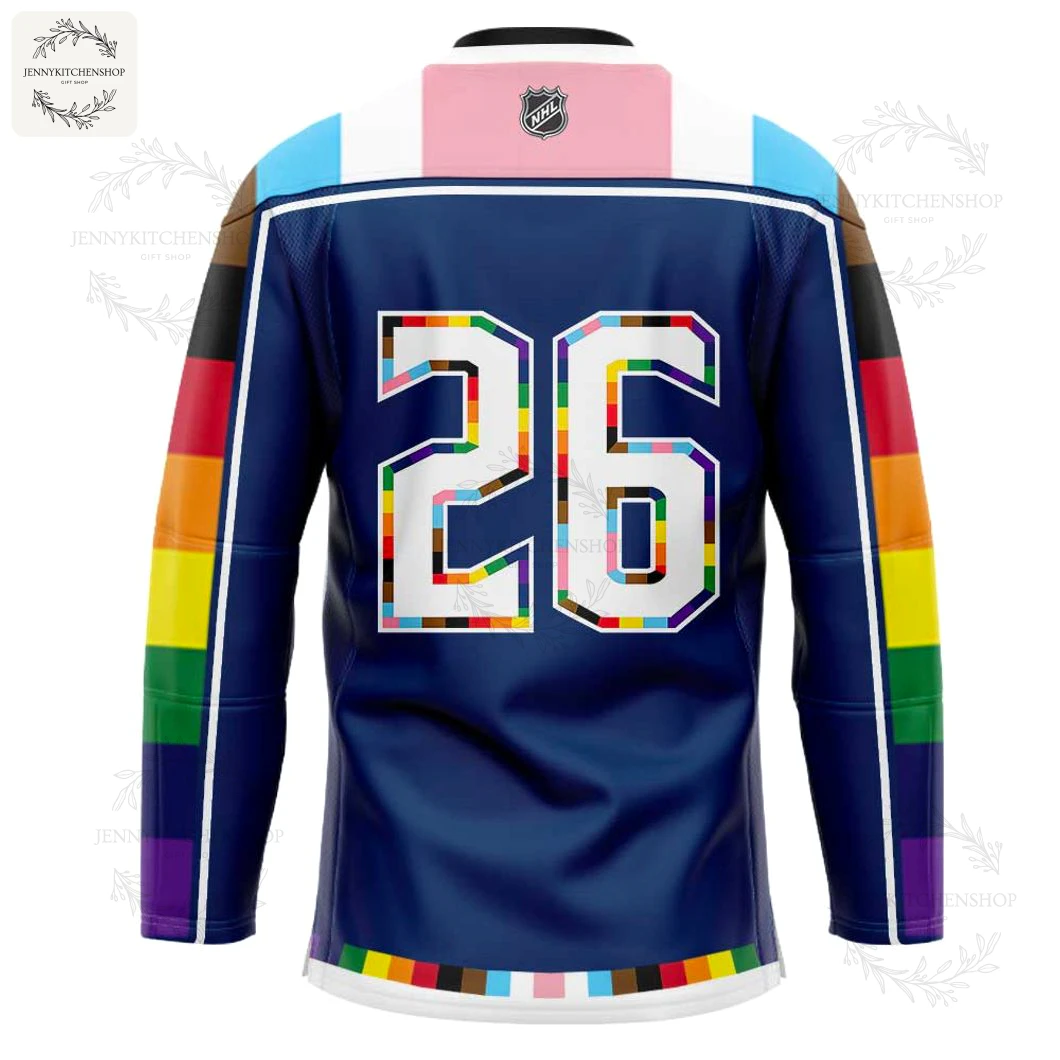 Close-up of the back of the Columbus Blue Jackets Pride jersey, featuring the number 26 filled with the Pride flag colors.