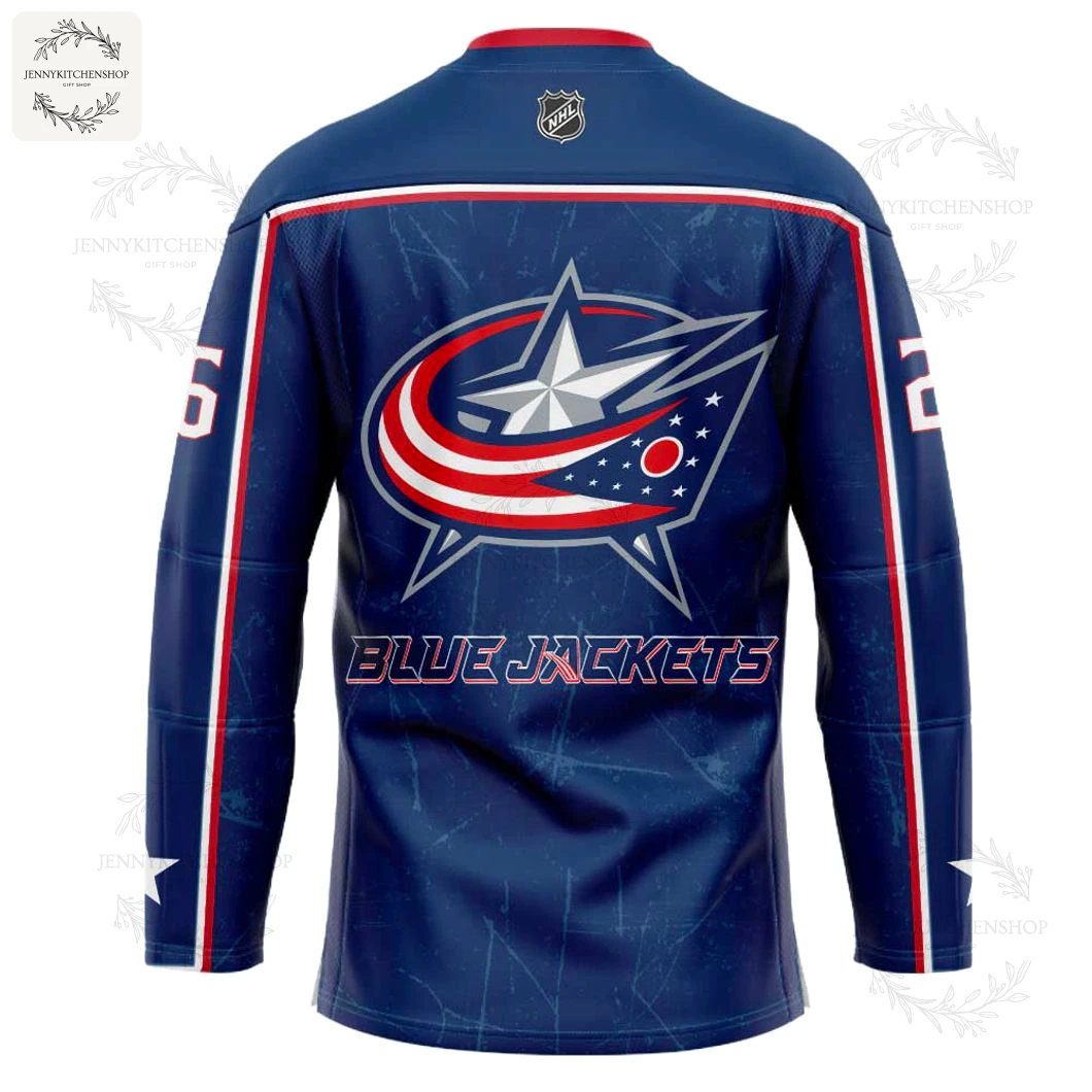 Close-up of the back of the Columbus Blue Jackets Superman jersey, displaying the team's star logo and the name BLUE JACKETS.