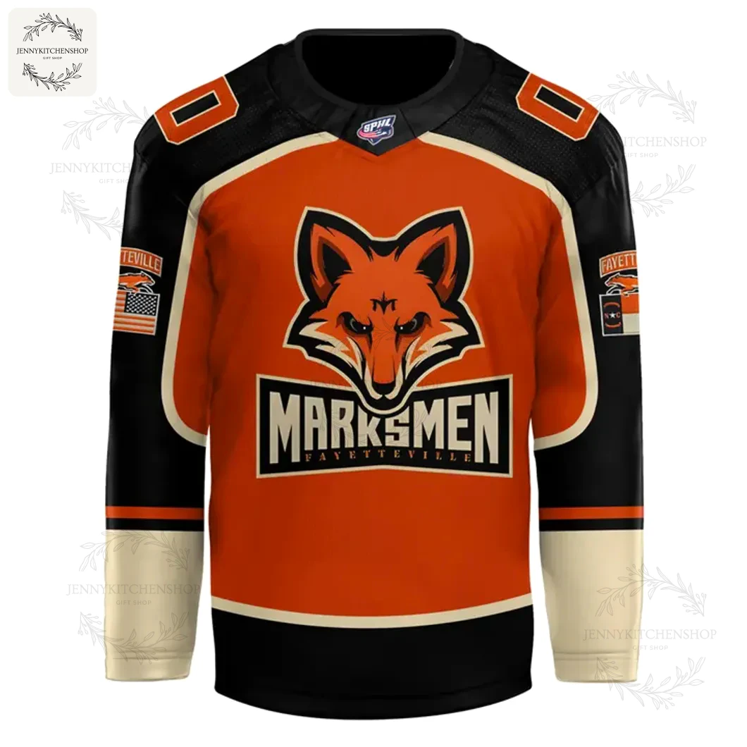 Front of the Fayetteville Marksmen alternate hockey jersey featuring the orange fox logo over the Marksmen wordmark on an orange body.
