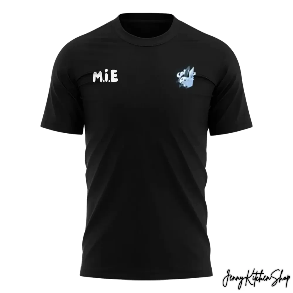 Front of the black Texas Legends x D'Moi 2026 t-shirt, showing the white M.I.E. text and the team logo graphic on the chest.