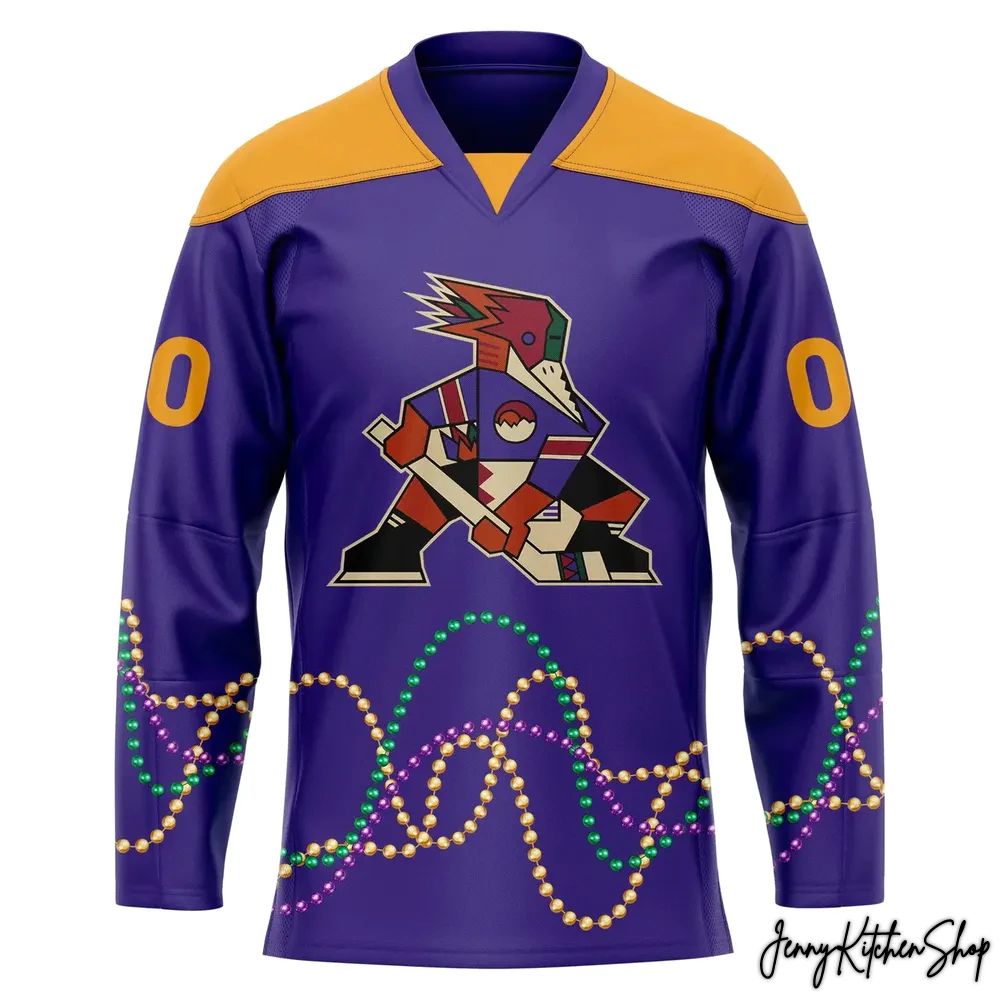 A front view of the purple and gold Tucson Roadrunners Mardi Gras jersey with the team logo on the chest and a bead design at the hem.